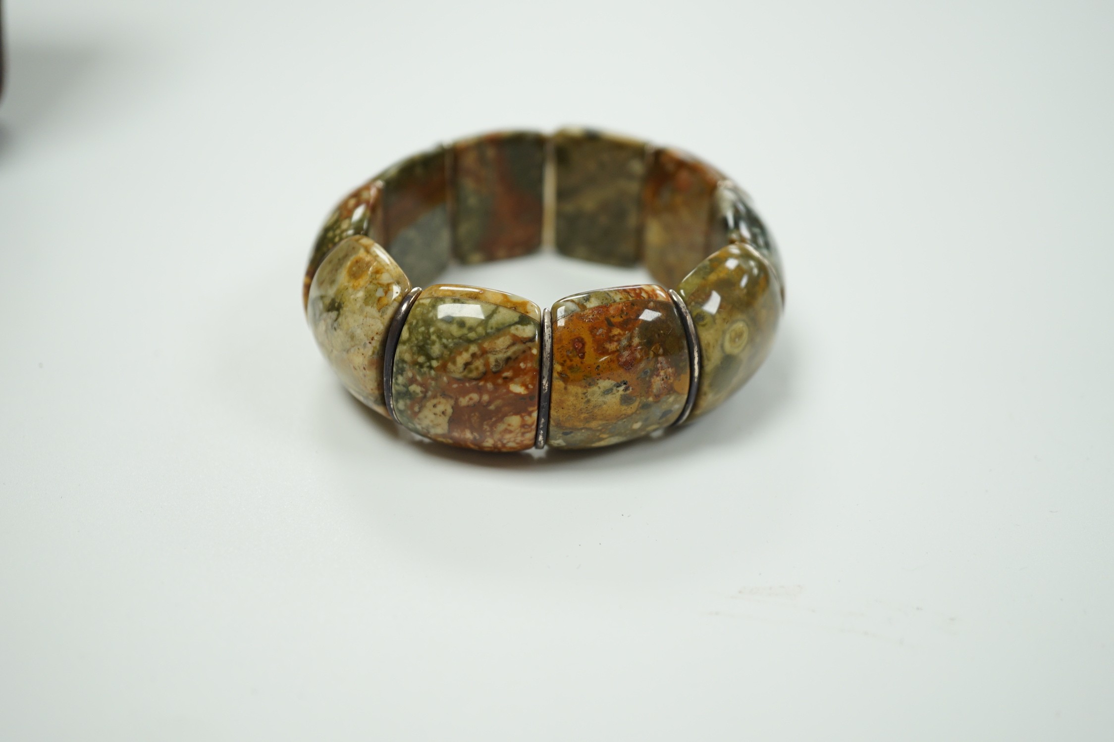 An early 20th century white metal and Scottish hardstone set flexible bracelet, with box.